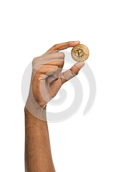 close up of hand with bitcoin over white