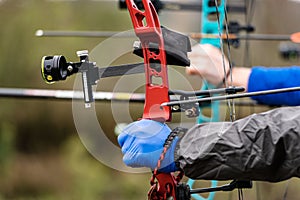 Archer Aiming with a Red Hunting Compound Bow