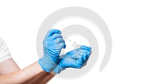 Close up hand in a blue sterile gloves to give cotton swab to bottle for sampling smear analysis.