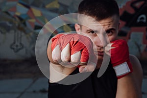 Close-up of hand of boxer ready for a fight.Strong arms and clenched fists