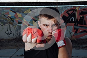 Close-up of hand of boxer ready for a fight.Strong arms and clenched fists