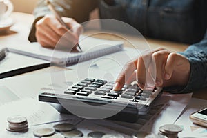 close up hand businesswoman using calculator for calculate finance accounting in office