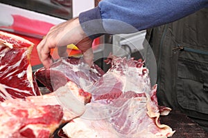 Close up of the hand of a butcher while working