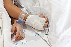 Close up of hand children sick sleeping on the bed