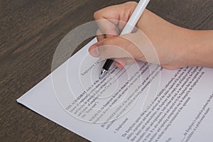 Close up of hand completing an employment application form