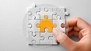 Close-up of a hand completing a jigsaw puzzle with the final piece, connecting.