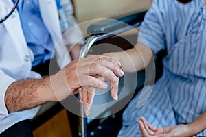 close up hand of doctor touching reassuring female patient. take care encourage patient.