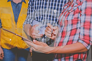 Close up of hand engineer holding digital tablet and meeting for