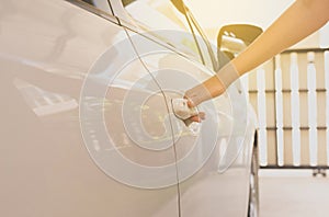 Close up of hand female driver open car door