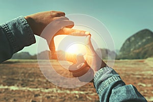 close up hand framing view distant