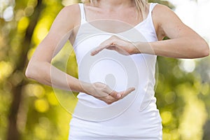 Close up hand gesture woman doing outdoor yoga