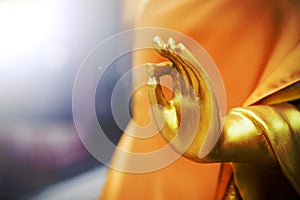 Close up hand of Golden buddha statue