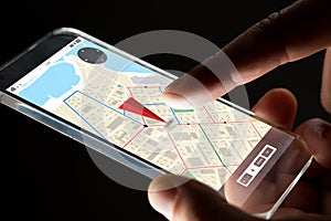 Close up of hand with gps map on smartphone