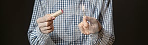 close up hand hold cracker and fire it on dark background isolated f