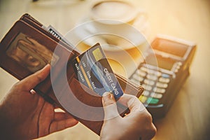 Close up of hand hold credit card to pay. Online payment . Paying by credit card