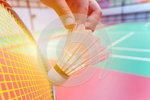 Close up hand hold serve badminton shuttlecock