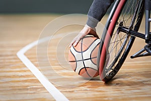 close up hand holding basketball