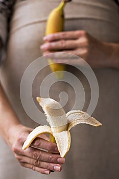 Close-up of hand holding delicious banana photo