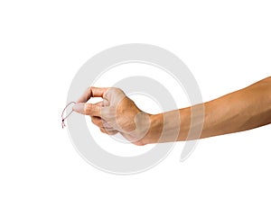 Close-up of hand holding hair rubber band on white back