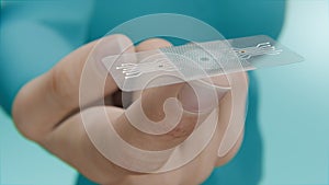 Close-Up of a Hand Holding a Hi Tech Vaccination Patch. Transdermal Vaccination: A Futuristic Method Using a Transparent photo