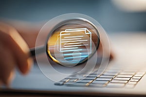 Close-up of a hand holding a magnifying glass over a digital notebook icon projected on a holographic screen, emphasizing document