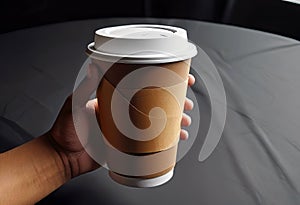 Close-up of a hand holding a paper cup with coffee, mockup illustration for design,