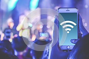 Close up hand holding phone and using internet wifi network connection communication technology concept