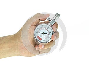 Close up hand holding silver tyre pressure gauge isolated on whi