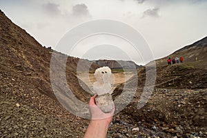 Close up hand holding snowman concept photo