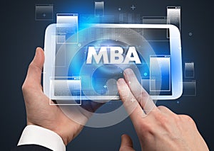 Close-up of a hand holding tablet