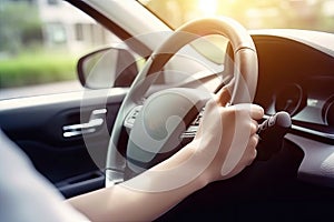 Close up hand holing or controlling steering wheel of car for driving, point of view inside car, on the highway road, with