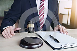 Close up of hand, Judge hitting gavel and scales of justice, Rep