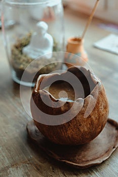 Close-up hand made brown coffee cup and aromatic stick