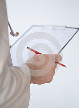 Close up Of Hand Male Doctor Filling The Medical Form. Close-up Of Male Doctor Filling The Medical Form. Doctor writting. Uniform