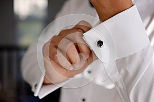 Close up of a hand man how wears white shirt and cufflink