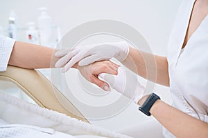 Close-up of hand massage in cosmetology clinic photo