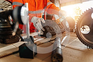 Close up hand of A mechanic man Small Excavator Repair and Maintenance. Heavy Equipment Mechanic Trying to Find an Issue.