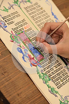 Close-up of hand of medieval manuscript scribe - calligraphy