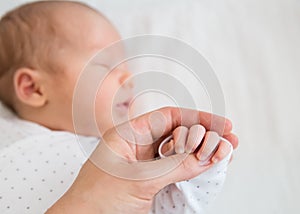 Close-up hand of a newborn baby