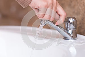 Close up hand open or close water tab