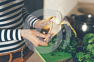 Close up of hand peeling a banana