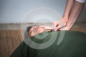 Close up hand of people  are doing first aid by Cardiopulmonary Resuscitation or CPR photo