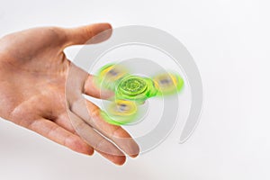 Close up of hand playing with fidget spinner
