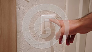 Close Up of Hand Pressing Button to Switch on the Light