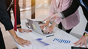 Close-up hand of Profession businesspeople office workers working in team conference on a laptop with project planning document on