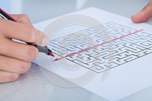 Close-up of hand solving puzzle