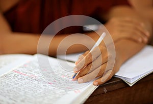 Close-up hand and textbook