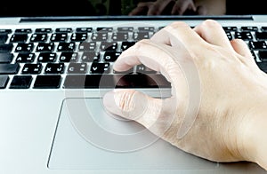 Close up hand type on laptop keyboard, Technology concept