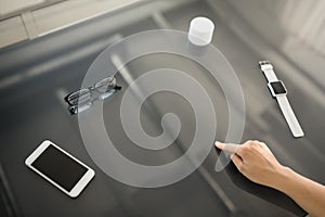 Close up of hand using black interactive panel