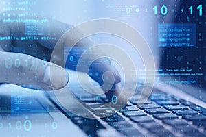 Close up of hand using laptop at desktop with abstract glowing blue coding background. Binary code, technology, data and internet